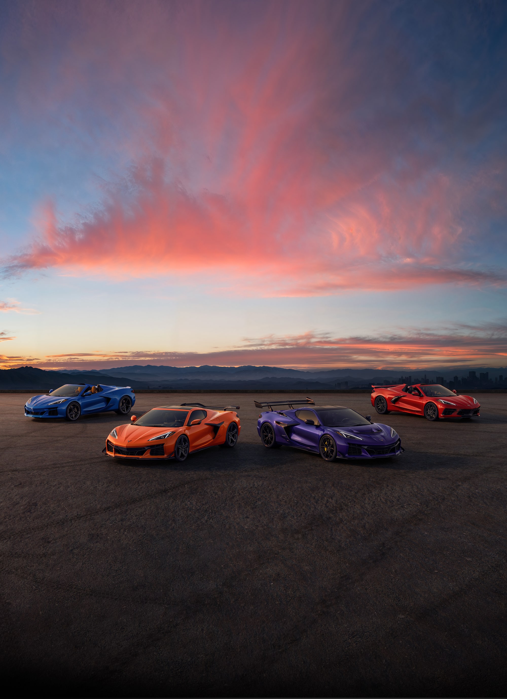 Lineup of Chevy Corvette under an Evening Sky