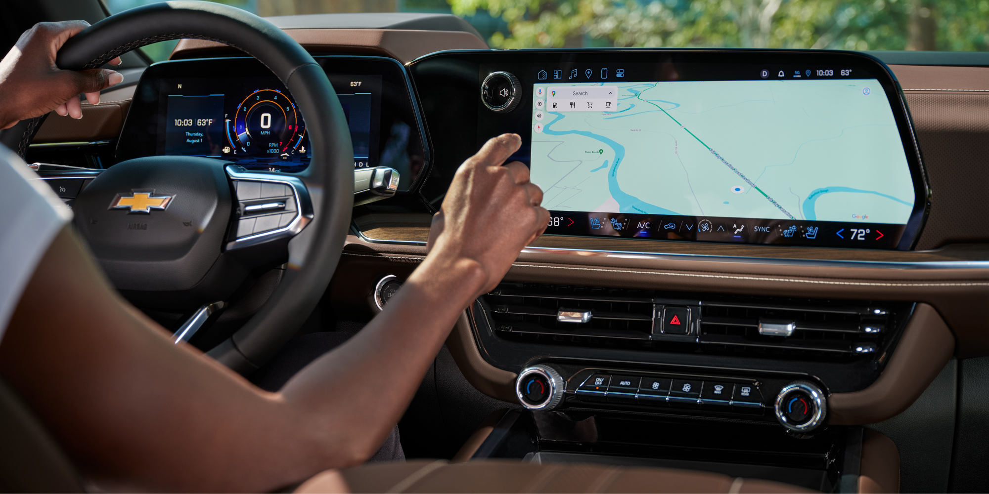 A Woman Setting Up the Navigation System on the Display Screen in the 2026 Chevy Tahoe
