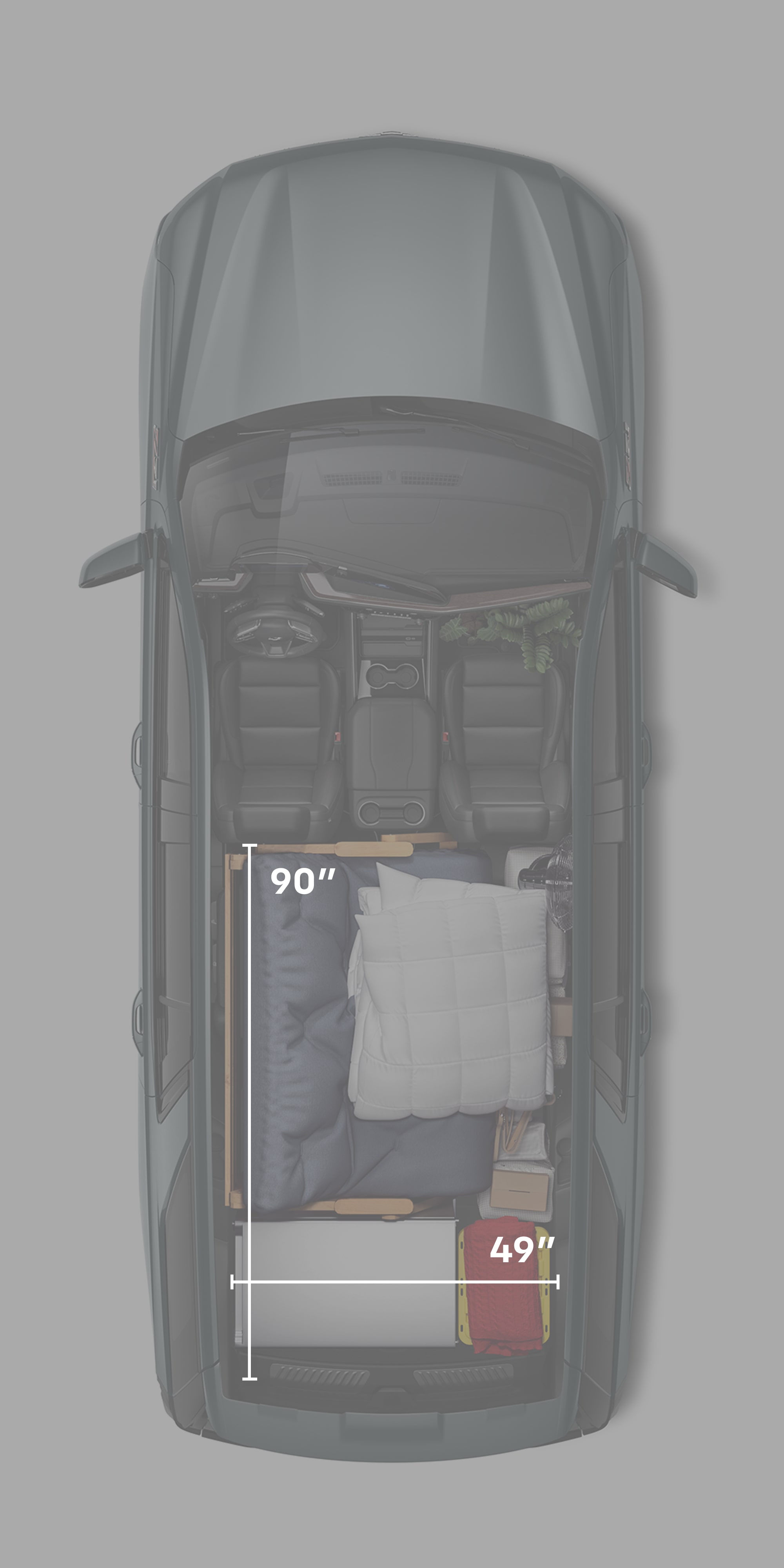 A Top View of the 2026 Chevy Tahoe Interior with Camping Materials Packed Up to the First Row