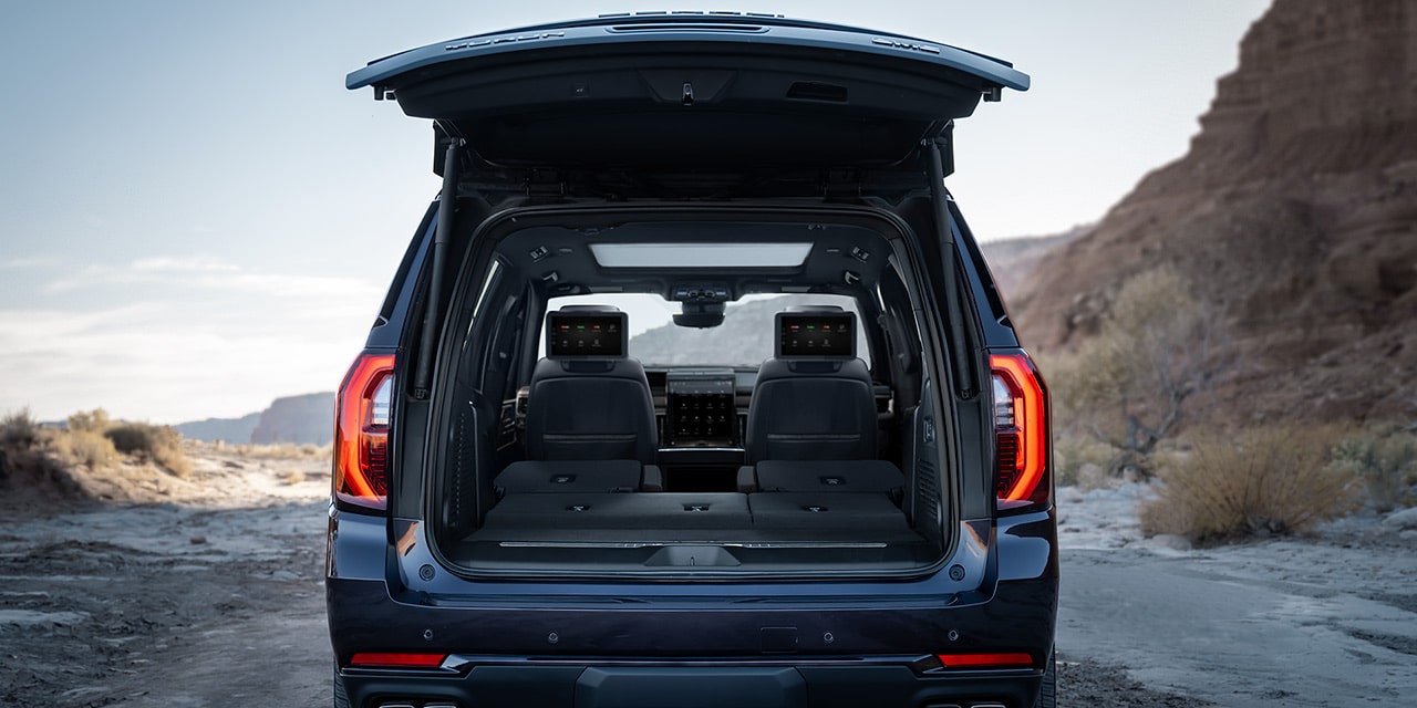 Rear View of the Open Tailgate Displaying the Cargo Space in the 2026 GMC Yukon Denali Luxury 3 Row SUV