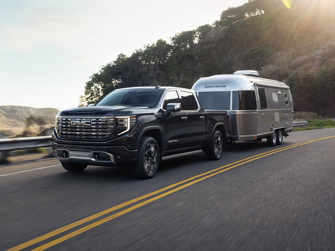 The 2026 GMC Sierra Denali Luxury Pickup Truck Pulling an Airstream Trailer